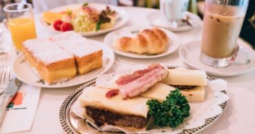 breakfast sandwiches served with coffee on a café breakfast menu